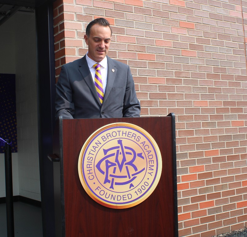 CBA Unveils Cavale Family Strength And Conditioning Facility image of cavale giving a speech
