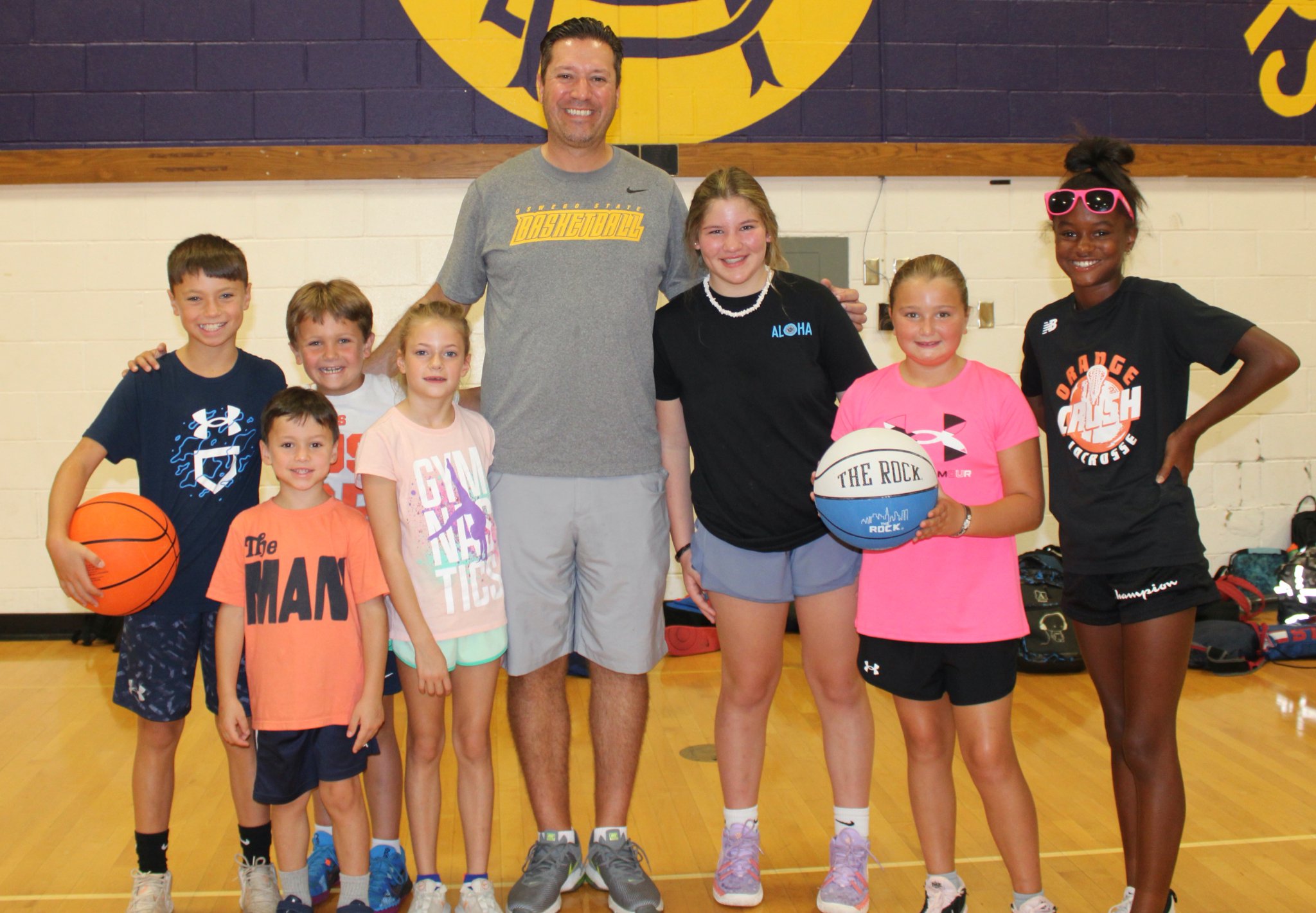 something for everyone at cba's summer sizzle near syracuse ny image of cba basketball coach with kids