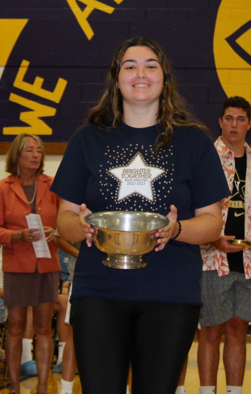 School Celebrates Mass of The Holy Spirit near syracuse ny image of student holding bowl