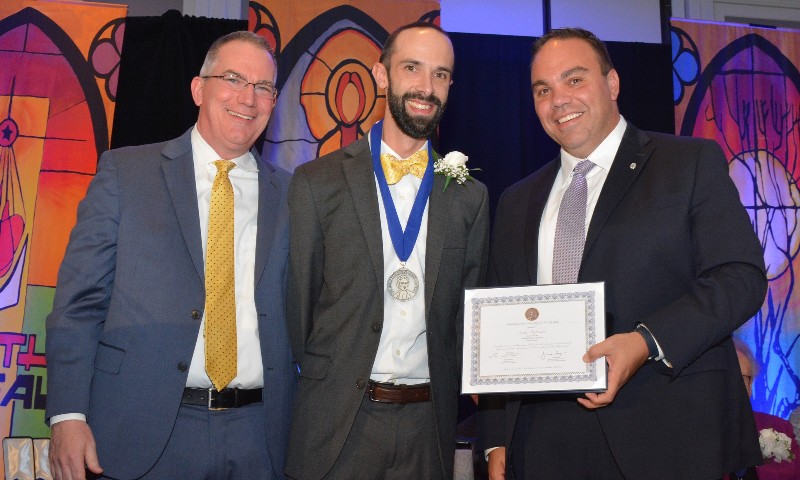 ribaudo selected distract of eastern north america lasallian educator of the year image of ribaudo holding award near syracuse ny