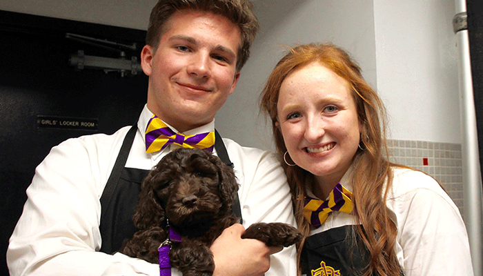 CBA Silent Auction Student Volunteers with Dog