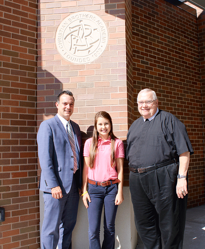 Pictured (l-r): Principal Matt Keough, Lizzie Lucas, and President Brother Joseph Jozwiak.