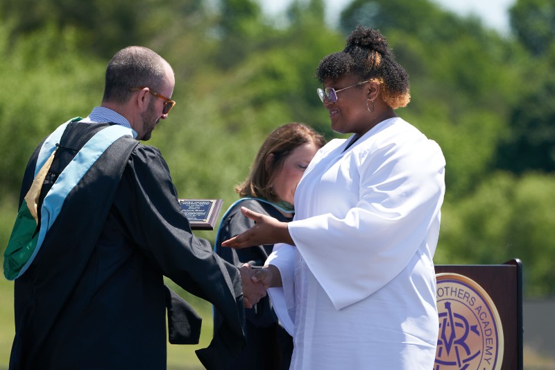 126 Students Graduate From Christian Brothers Academy near syracuse ny image of student shaking hands