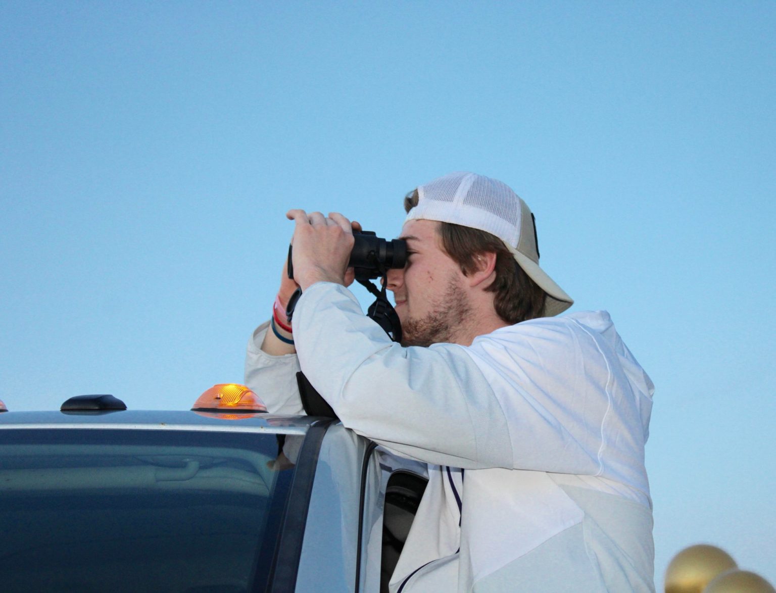 Senior Wyatt Auyer taking in the video from his truck.