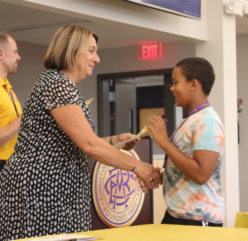 Bridge To CBA Brothers Participants Recognized At Reception near syracuse ny image of student receiving award