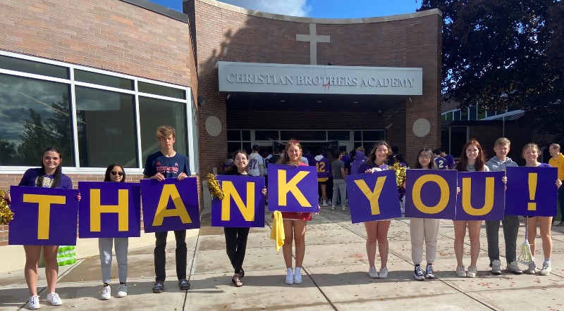 the fund for cba near syracuse ny image of students holding up thank you sign