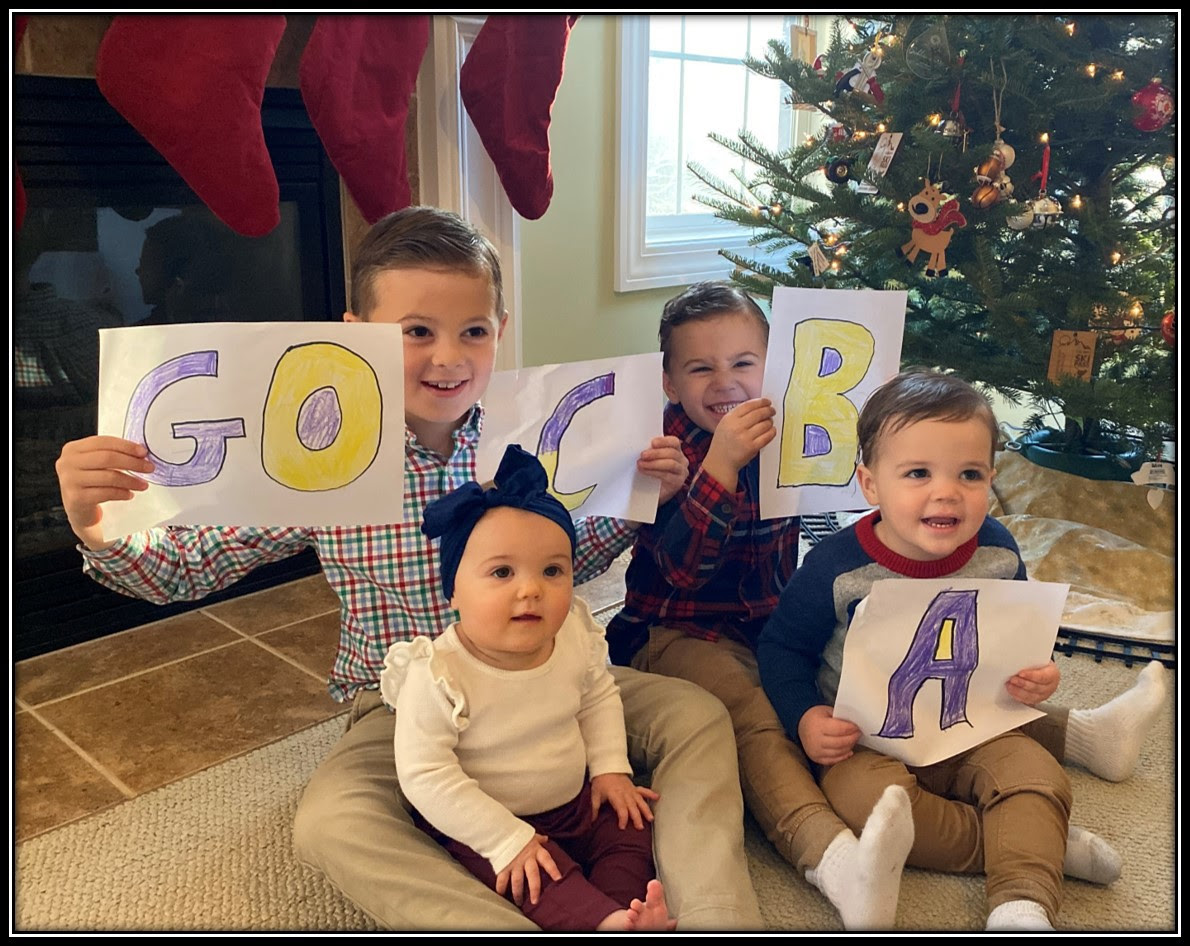 Christian Brothers Academy President Matthew Keough's children holding up "Go CBA"