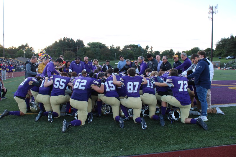 Alumni, Family And Friends Gather For Homecoming Celebration near syracuse ny image of football team