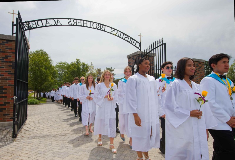 2024 cba graduating seniors walking to the ceremony near syracuse ny