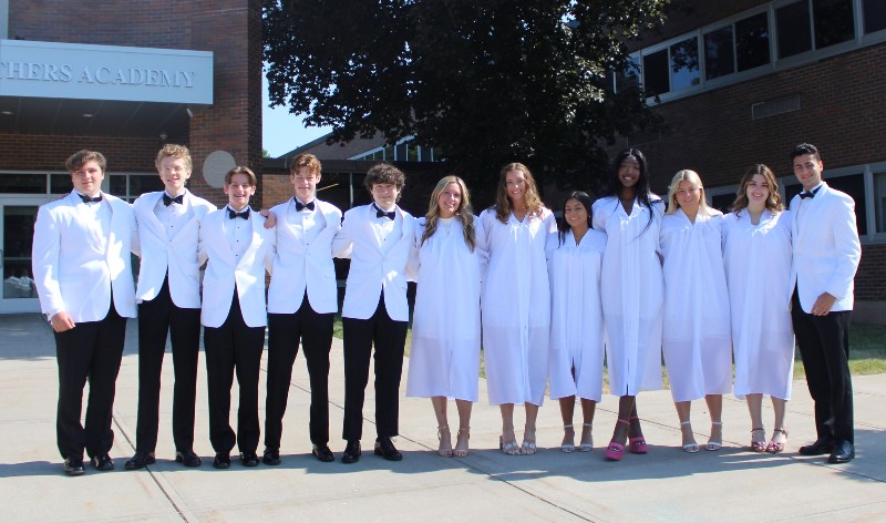 graduating ceremony for class of 2023 image of seniors in front of cba building