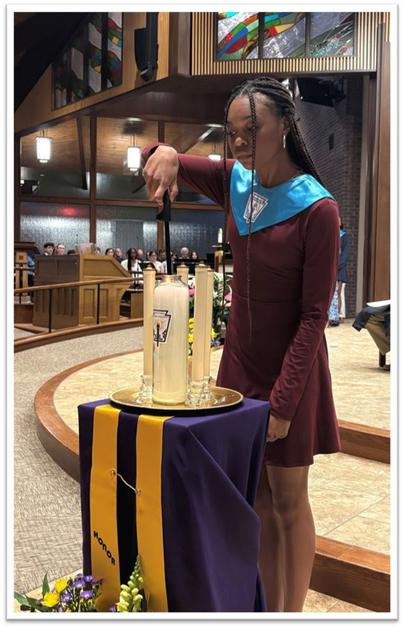 Student at Christian Brothers Academy in Syracuse, NY lights the Scholastic Honors Night Candle.