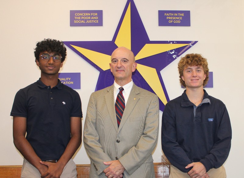 Kodali And Roueche Named Semifinalists In National Merit Scholarship Program near syracuse ny image of students with principal