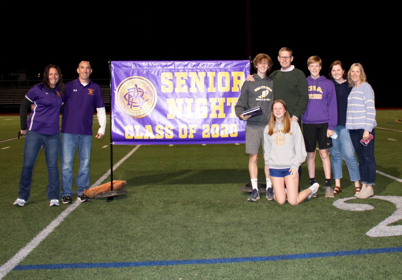 Riley Nash and family with track coaches Theresa and Doug Lewis.