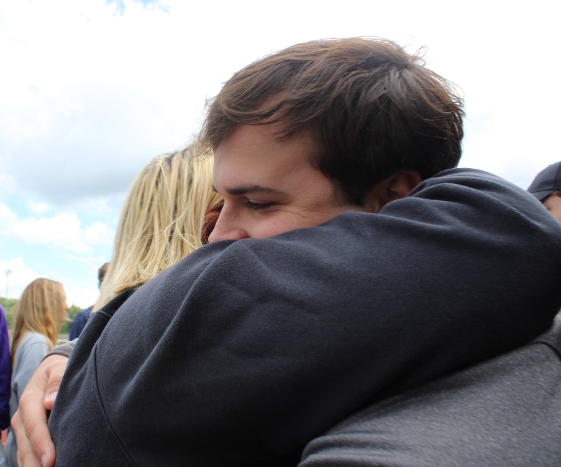 CBA Community Celebrates Founder's Day 2022 near syracuse ny image of student hugging parent