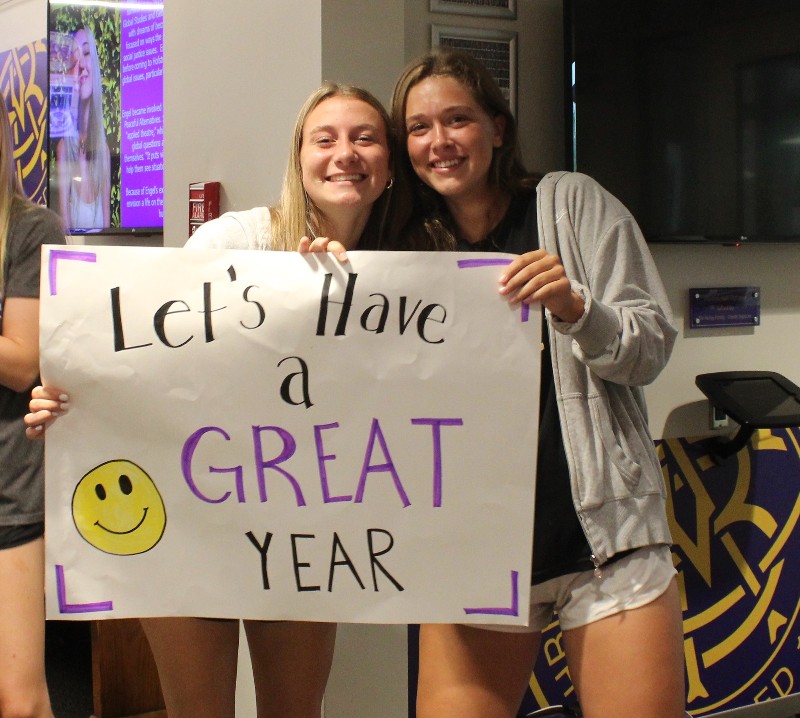 Welcome Back Brothers near syracuse ny image of girls holding sign