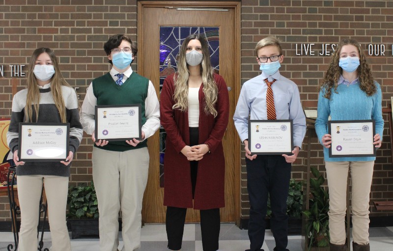 Four Students Compete In Spelling Bee near syracuse ny image of team smiling with award