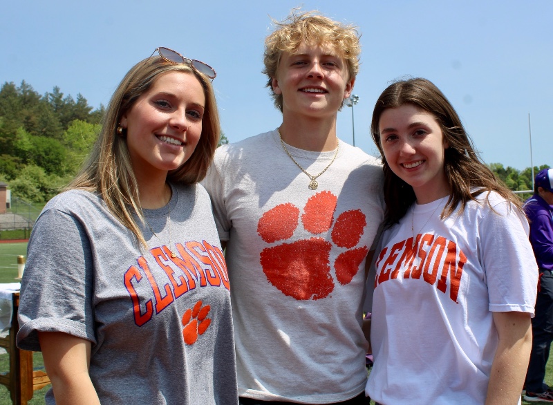 college bound class of 2023 image of three cba students wearing clemson tshirts