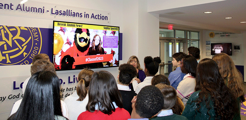 Susan Major takes her seventh grade religion class on a tour of Alumni Hall