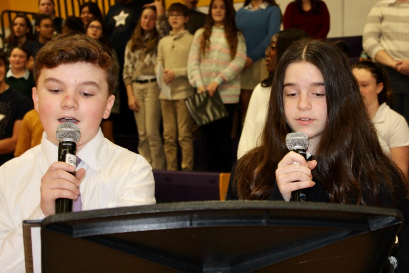 cba celebrates feast of immaculate conception image of students singing near syracuse ny