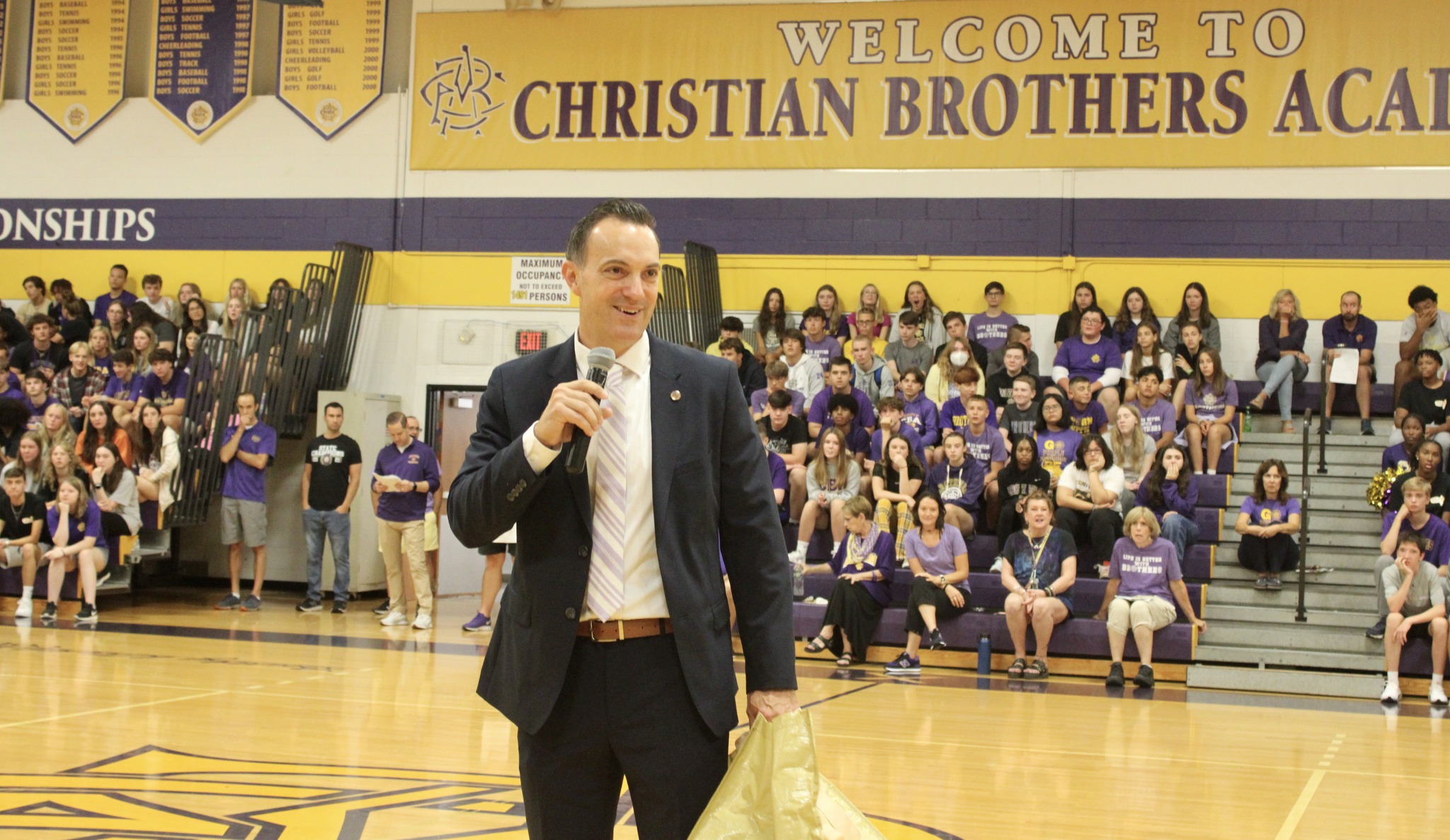 Welcome Back Brothers near syracuse ny image of president talking to students in gym