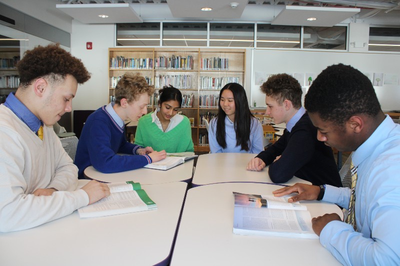 learning commons and technology near syracuse ny image of students reading in library