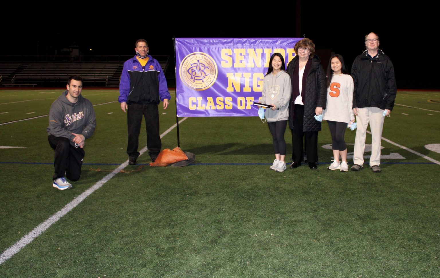 Maura Clare Conan and her family with softball coach Mike Cusano.