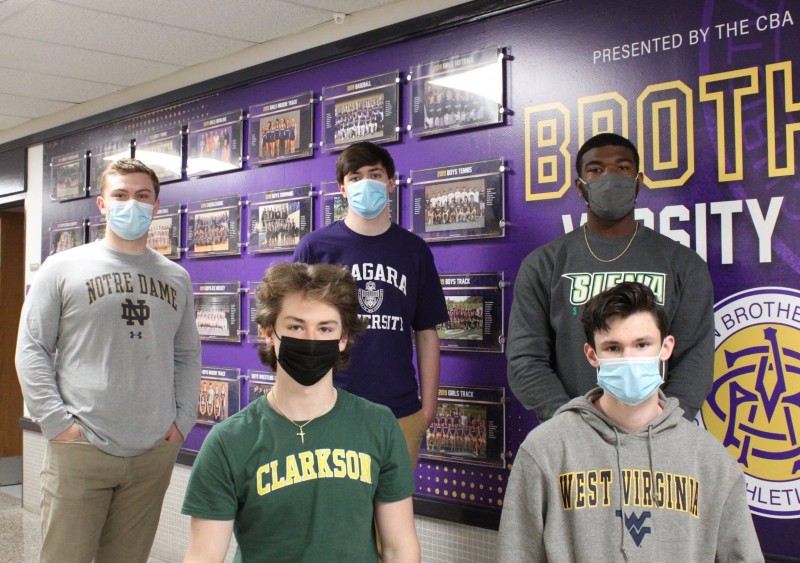 Class of 2021 College Destinations near syracuse ny image of cba male students with college acceptance shirts