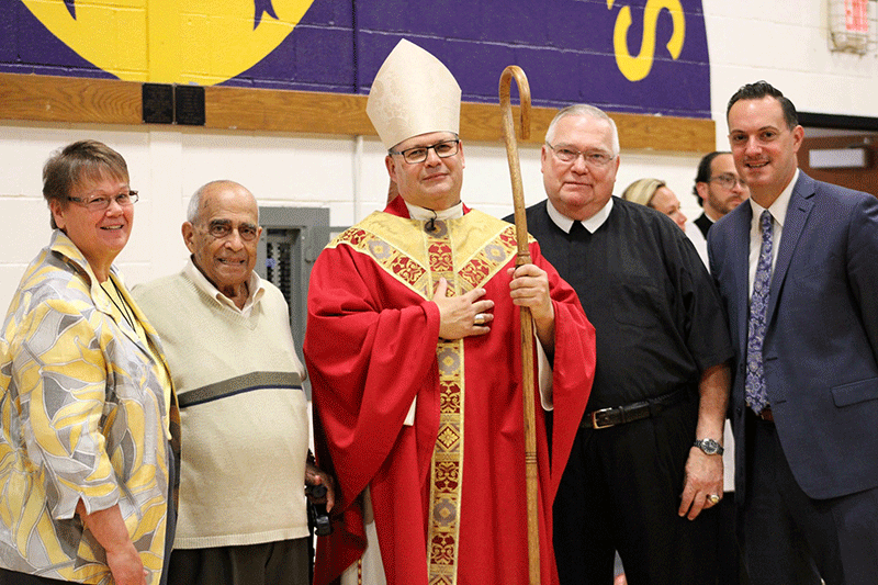 Pictured with Bishop Lucia (l-r): Sister Suzanne Dunn, Assistant Principal for the Junior High; Brother Gabe Fiumano ’47, President Brother Joseph Jozwiak, and Principal Matt Keough