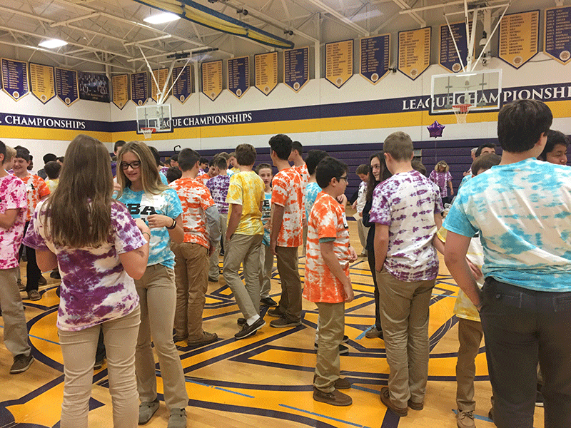 image of students in tie dye shirts in gym