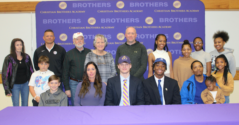 Football Student-Athletes Rae & Pitts Sign Their Division I Letters Of Intent image of students