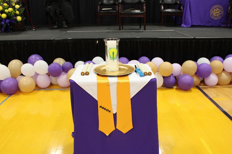 More Than 150 Students Inducted Into National Honor Society near syracuse ny image of candle for national honor society assembly