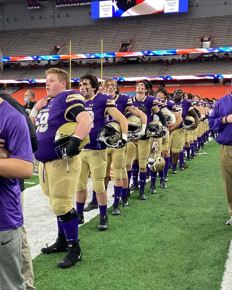 Purple Reign..Brothers Crowned State Champs near syracuse ny image of football players on field