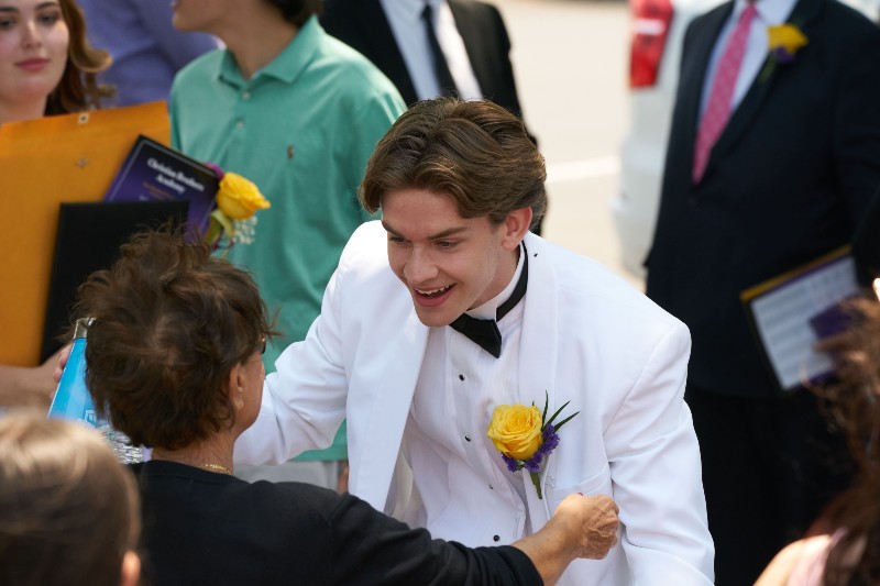 award ceremony june 2023 from cba image of graduating student hugging mom